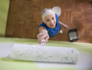 Woman painting wall